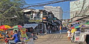 ‘Forced’ evictions eat away at a Manila community as developer spares the golf course next door